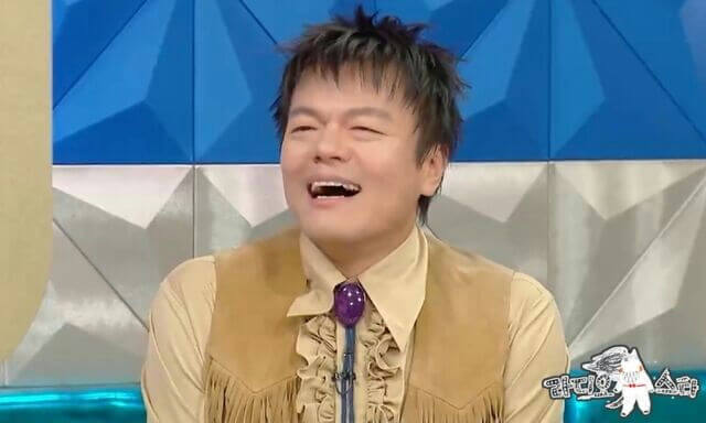people-J.Y. Park (Park Jin-young)-clothing-cowboy vest-clothing-ruffled shirt-accessory-bolo tie-expression-laughing