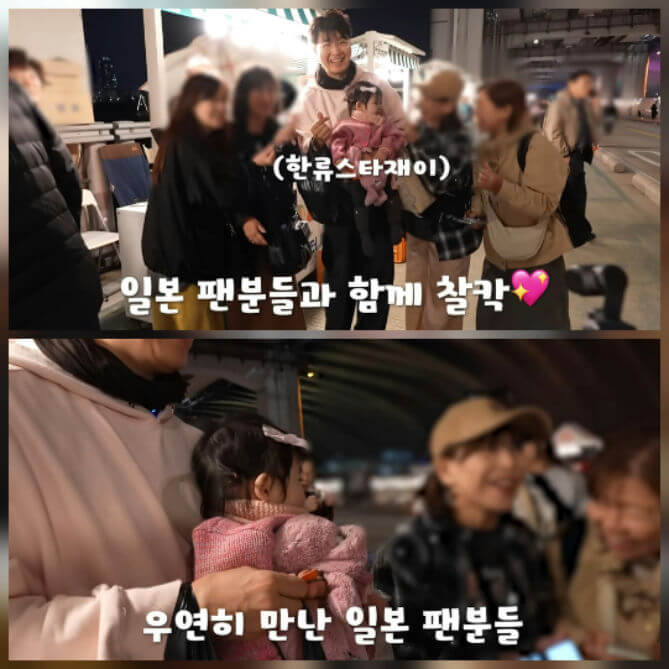 people-man holding baby-A-smiling-A-fans-B-group photo-C-street setting