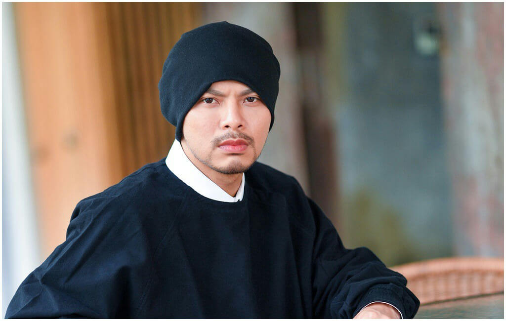 people-Asian man-black beanie-black loose top-white collared shirt-stubble