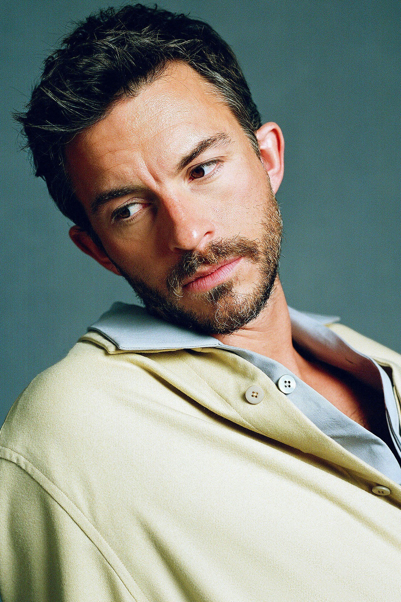 people-man-A-portrait-A-beard-A-looking-away-A-light-yellow-jacket-A-blue-collar