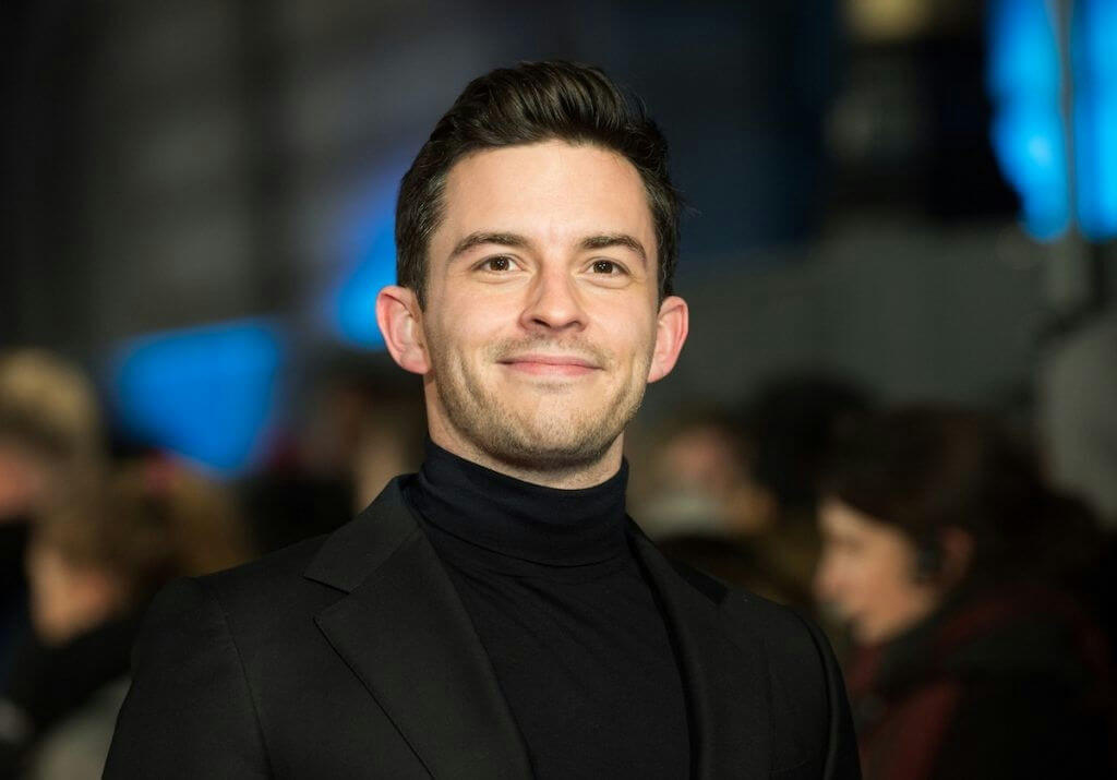 people-Man-A-smiling-A-turtleneck-B-black suit-C-event