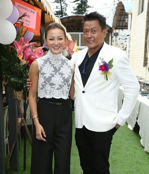 people-woman and man-smiling-A-lace top-B-white blazer-C-outdoor event