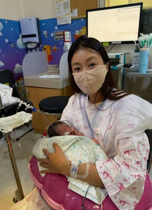 people-1-woman-A-baby-A-hospital setting-A-mask-B-IV line-B-newborn care-C