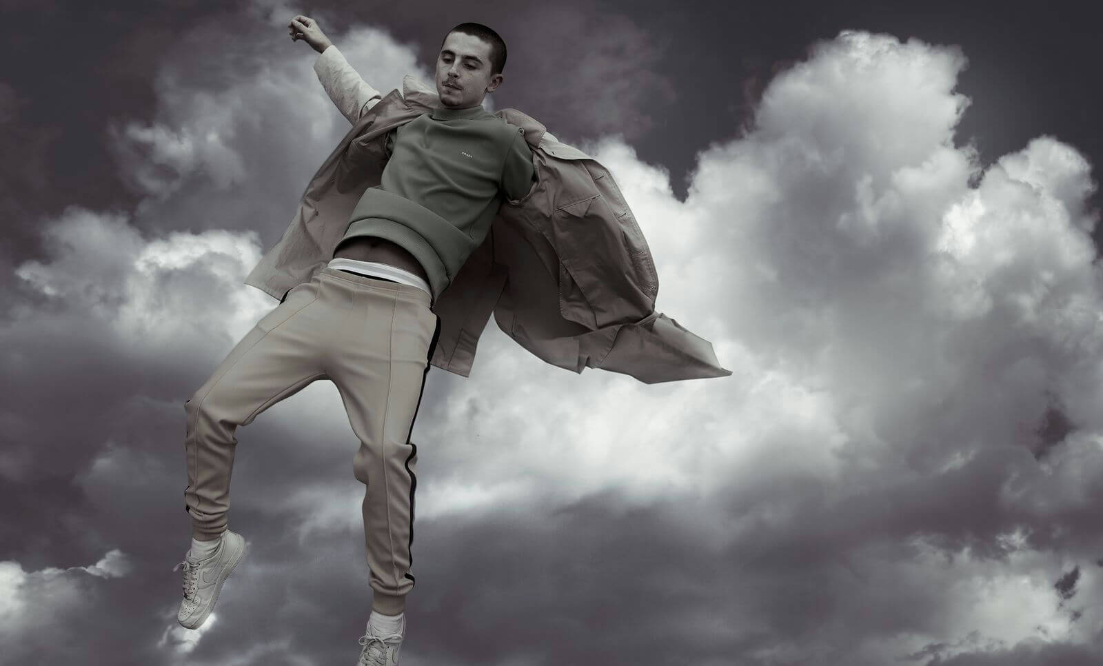 people-1-Timothée Chalamet-A-levitating-A-stormy sky-B-fashion-C-monochrome