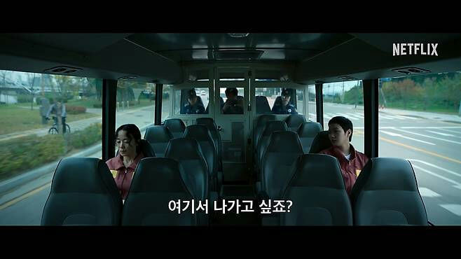 people-2-woman-A-man-B-guards-C-bus-D-Netflix-E-Korean-F