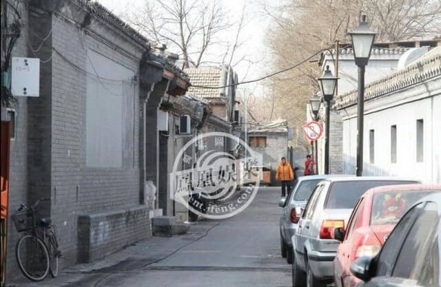 people-two-pedestrians-A-street-A-traditional-architecture-B-parked-cars-C