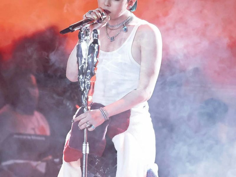 people-A-G-Dragon-A-singer-A-performing-A-white-tank-top-A-microphone-A-stage-lighting