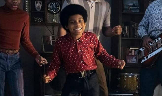 people-boy smiling in red polka-dot shirt-A-man in red turtleneck and jeans-B-man in striped shirt-C-musician with guitar