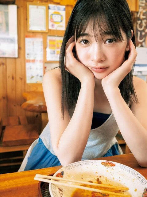 people-1-woman-A-resting face on hands-B-ramen bowl-C-wooden interior