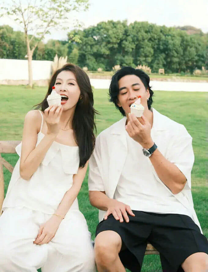 people-two-couple-eating-cupcakes-outdoors-white-attire