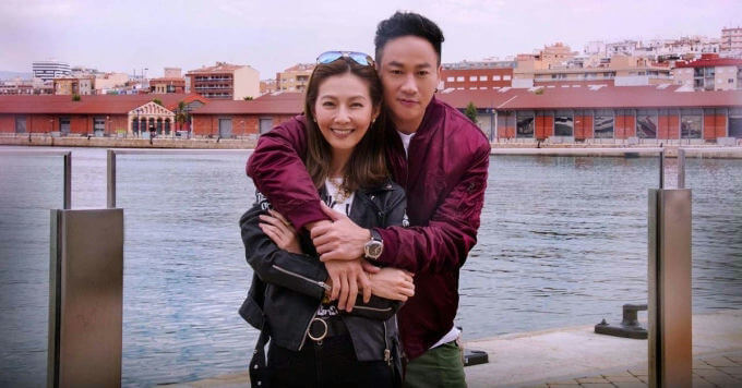 people-couple-A-outdoors-A-hug-A-waterfront-A-cityscape