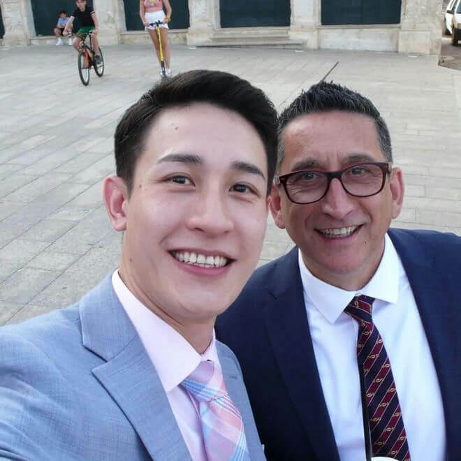 people-2-selfie-men-suits-outdoor-background-activity