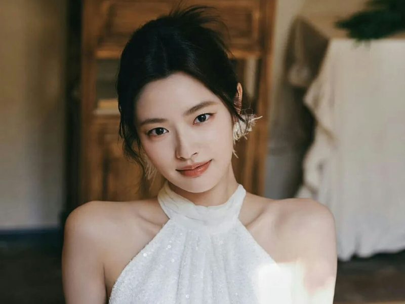 people-woman-A-white halter top-B-dark hair updo-C-soft lighting