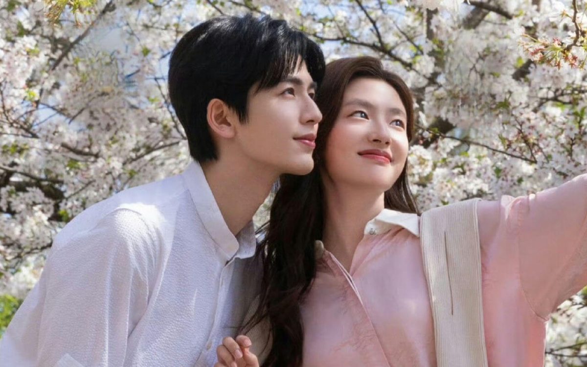 people-A-Asian man-A-Asian woman-A-cherry blossoms-A-outdoor-A-couple-A-smiling