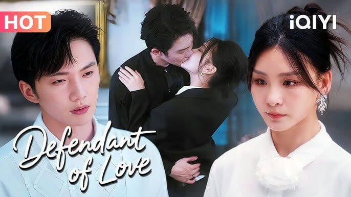 people-man in light shirt-woman in dark suit kissing man-woman in white shirt-kiss-iQIYI logo-HOT label-Defendant of Love text