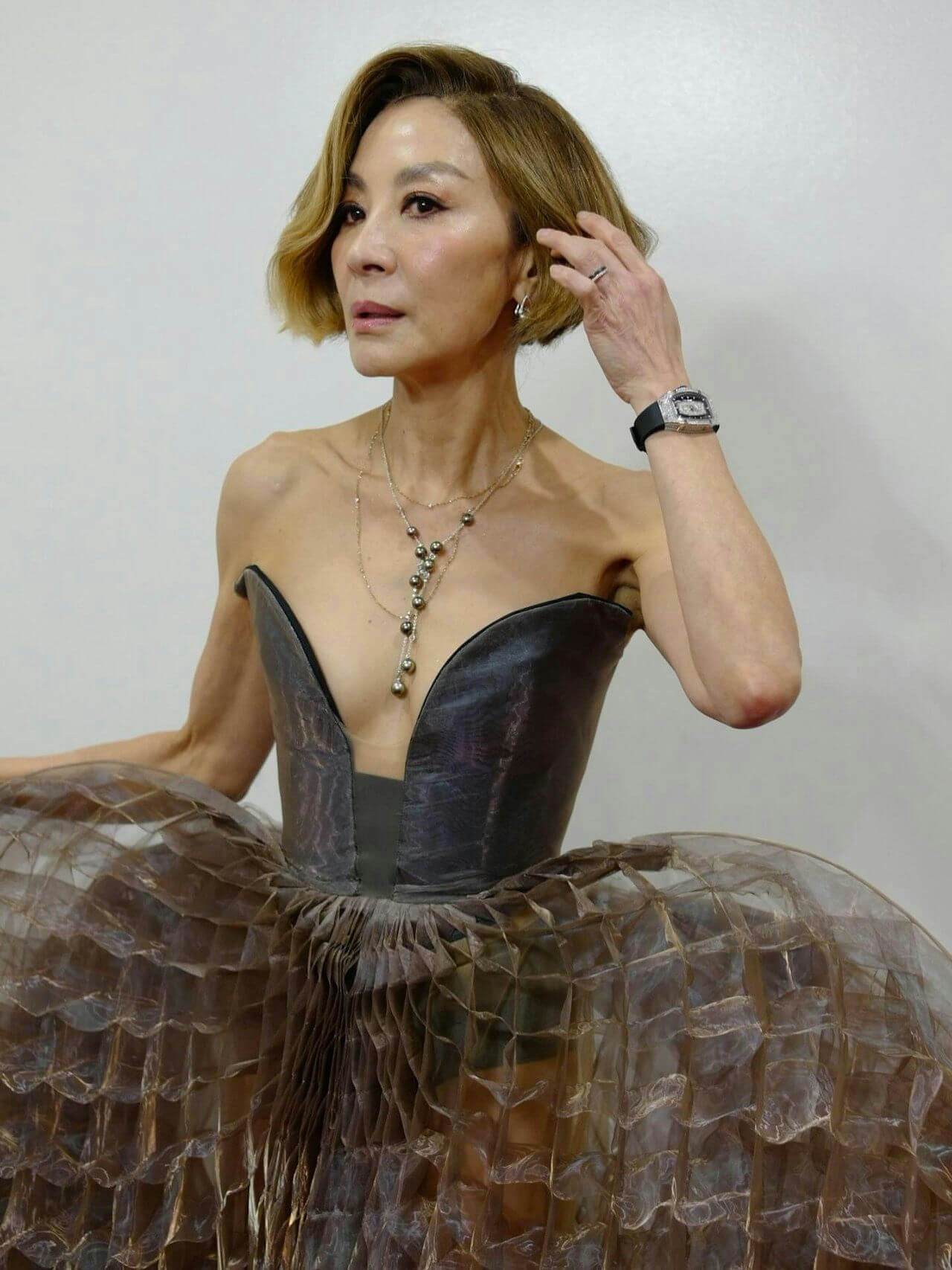 people-Michelle Yeoh-A-Strapless gown-A-Short blonde hair-A-Pearl necklace-A-Diamond watch