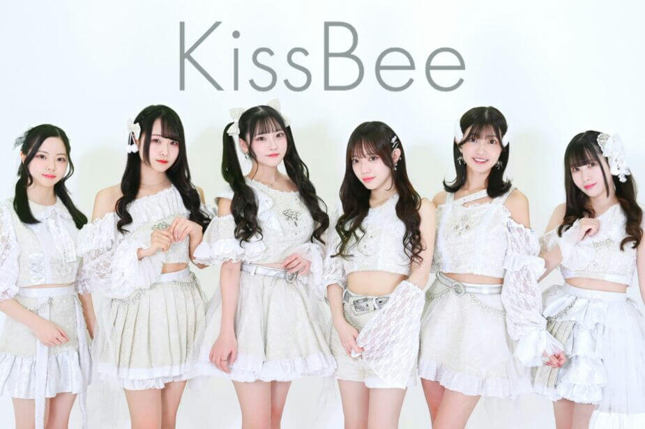 people-Six-women-A-Japanese-idol-group-A-white-and-silver-outfits-A-lace-and-ruffles-B-light-background-B-logo-text-KissBee-C