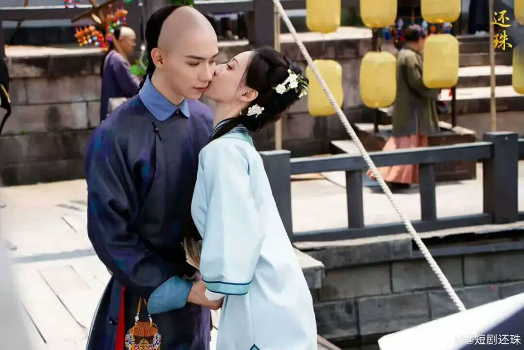 people-man-kissing-woman-Chinese-historical-costume-woman-kissing-man-pale-blue-dress-man-partially-shaved-head