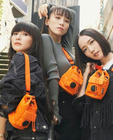 people-Three Japanese women-A-fashion-A-orange drawstring bags-A-streetwear-B-posing-B-casual denim outfits-C-bright accessory contrast