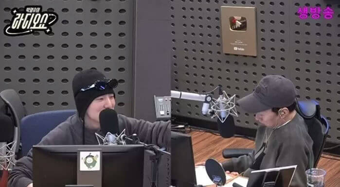 people-two men-A-radio studio-A-microphones-B-beanies and caps-C