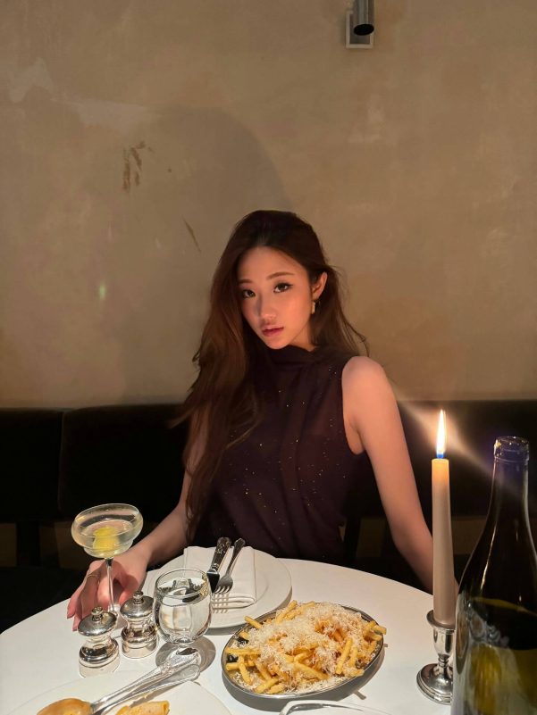 people-A-woman-A-dining-A-candlelit-A-restaurant-A-cocktail-A-french-fries
