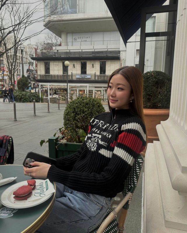 people-A-woman-A-cafe-A-sweater-A-outdoors