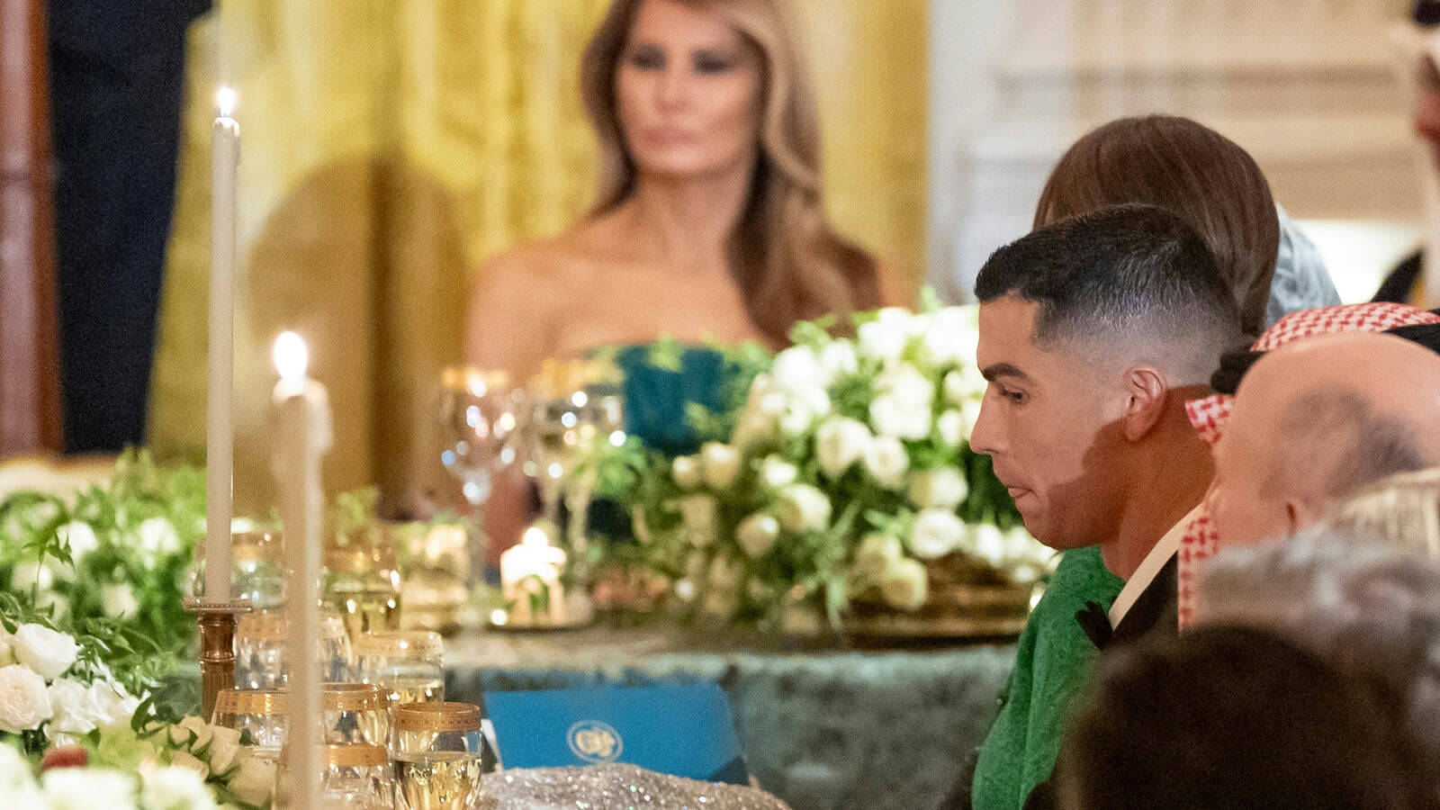 people-Cristiano Ronaldo-A-Melania Trump-A-formal dinner-B-candlelight-C-table decorations