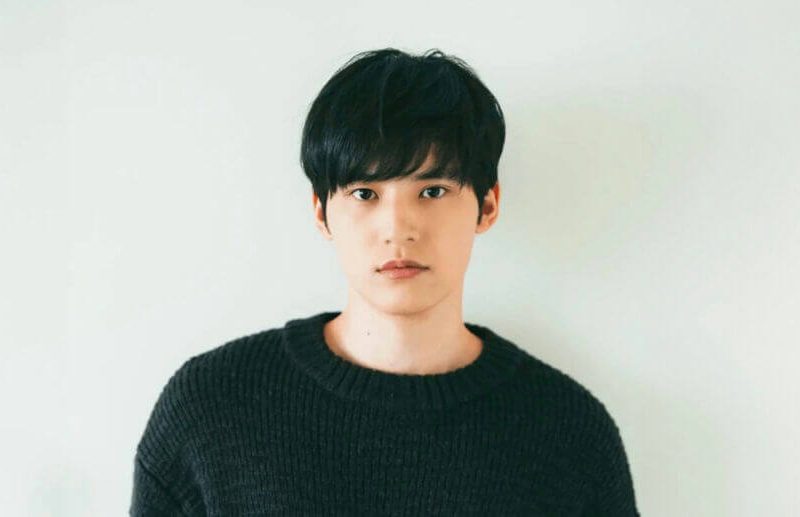 people-one male-A-Asian descent-A-black hair-A-black sweater-A-neutral expression