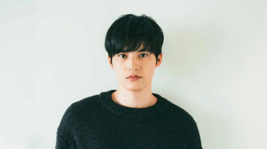 people-one male-A-Asian descent-A-black hair-A-black sweater-A-neutral expression