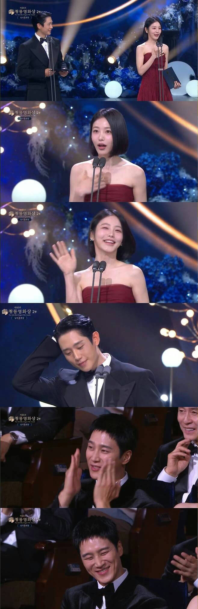 people-male actor in tuxedo on stage-A-female actress in red dress on stage-A-female actress with short black hair smiling-B-male actor adjusting his hair and smiling-C-male audience member applauding-D-male audience member laughing widely