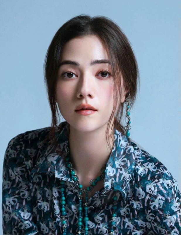 people-woman-A-portrait-A-dark hair-A-teal jewelry-A-patterned shirt-B-serious expression-C