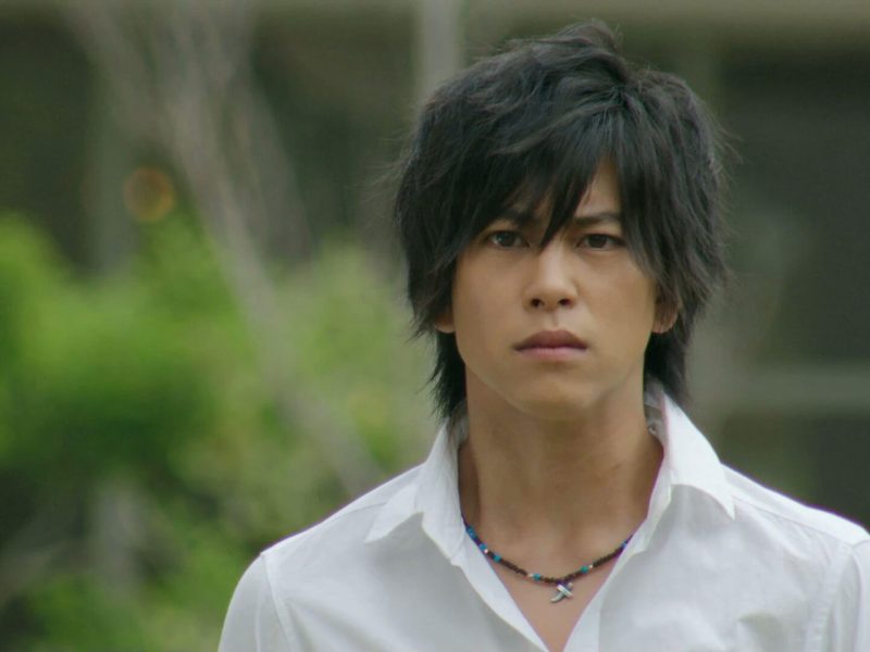 people-man-A-dark hair-A-white collared shirt-A-necklace with cross pendant