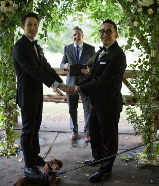 people-2 grooms-A-officiant-A-dog-A-wedding ceremony