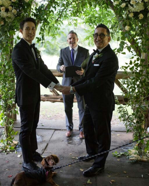 people-2 grooms-A-officiant-A-dog-A-wedding ceremony