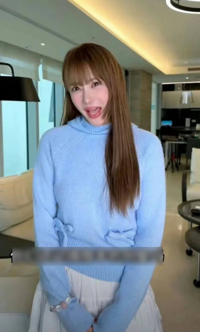 people-woman-A-blue sweater-B-long brown hair-C-white skirt