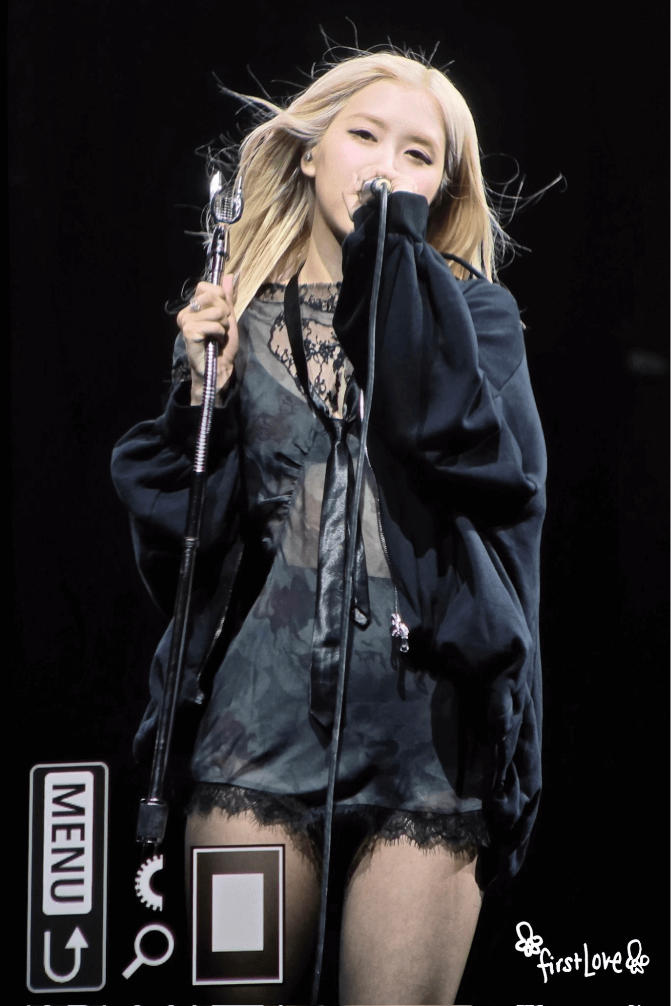 people-woman-blonde hair-A-singer-A-microphone-B-black outfit-C