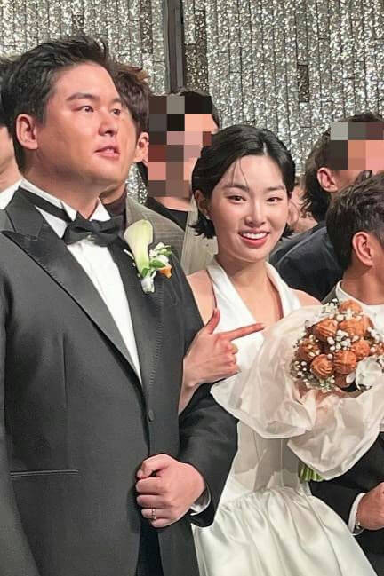 people-bride and groom-A-wedding attire-B-holding a bouquet-C-smiling