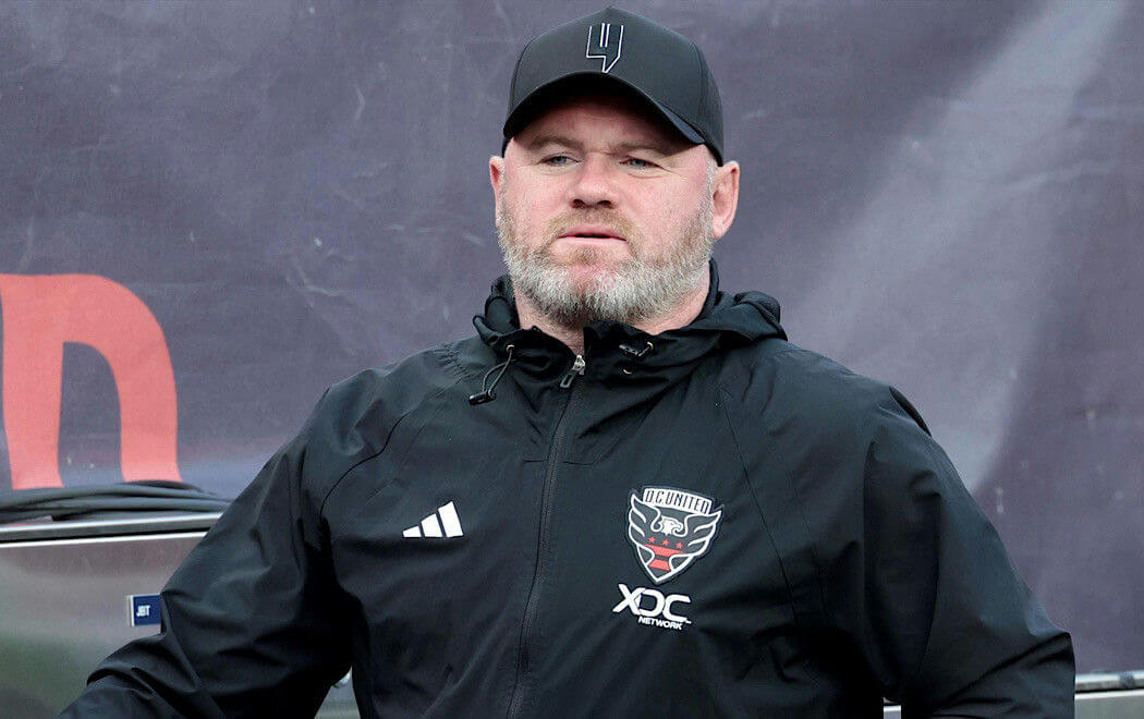 people-Wayne Rooney-A-coach-A-black jacket-A-beard-A-black baseball cap