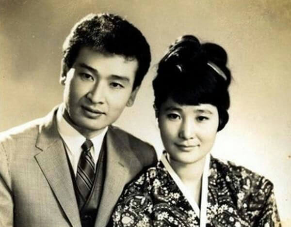 people-A-man-A-woman-A-East Asian-A-vintage photograph-A-formal attire-A-hanbok-A-suit and tie