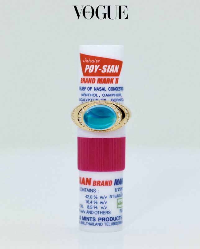 A white background-A-Vogue Korea logo-A-Poy-Sian inhaler-A-Gold ring-A-Turquoise gemstone-A-Diamonds