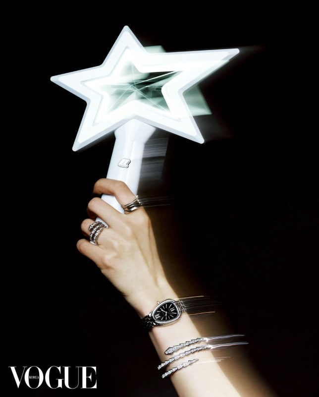 people-A-hand holding light stick-A-fashion jewelry-B-luxury watch-C-Vogue Korea logo