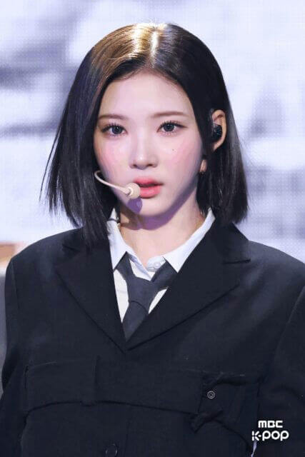 people-woman-A-K-pop-idol-A-short-black-hair-A-black-suit-and-tie-A-headset-microphone