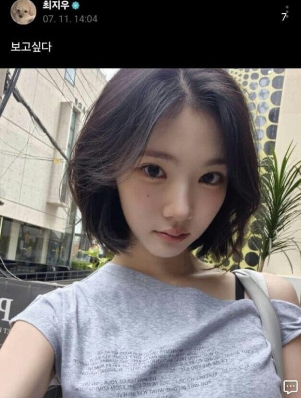 people-1-woman-A-selfie-B-short black hair-C-off-the-shoulder grey top
