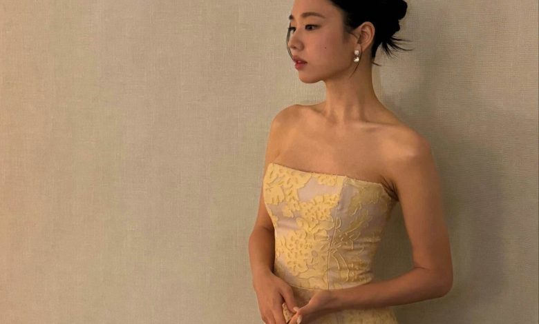 people-woman-A-yellow strapless dress-B-pearl earrings-C-updo hairstyle