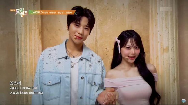 people-two-young-adults-A-male-and-female-A-K-pop-performers-A-holding-hands-B-light-blue-embellished-denim-jacket-C-pink-off-the-shoulder-top