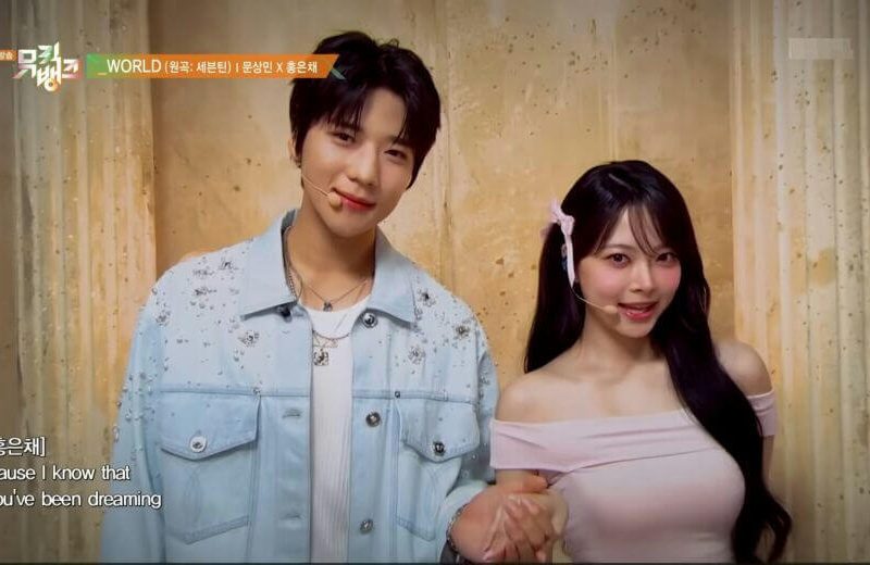 people-two-young-adults-A-male-and-female-A-K-pop-performers-A-holding-hands-B-light-blue-embellished-denim-jacket-C-pink-off-the-shoulder-top