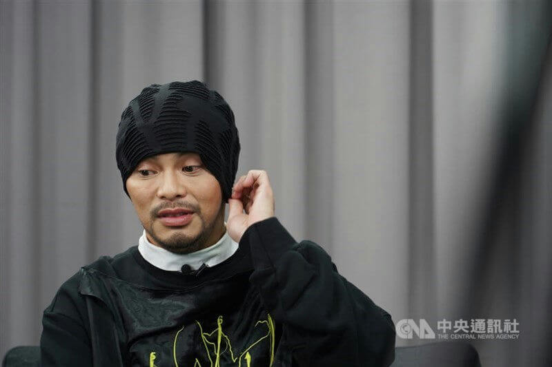 people-A-man-A-black beanie-B-black sweatshirt-C-interview