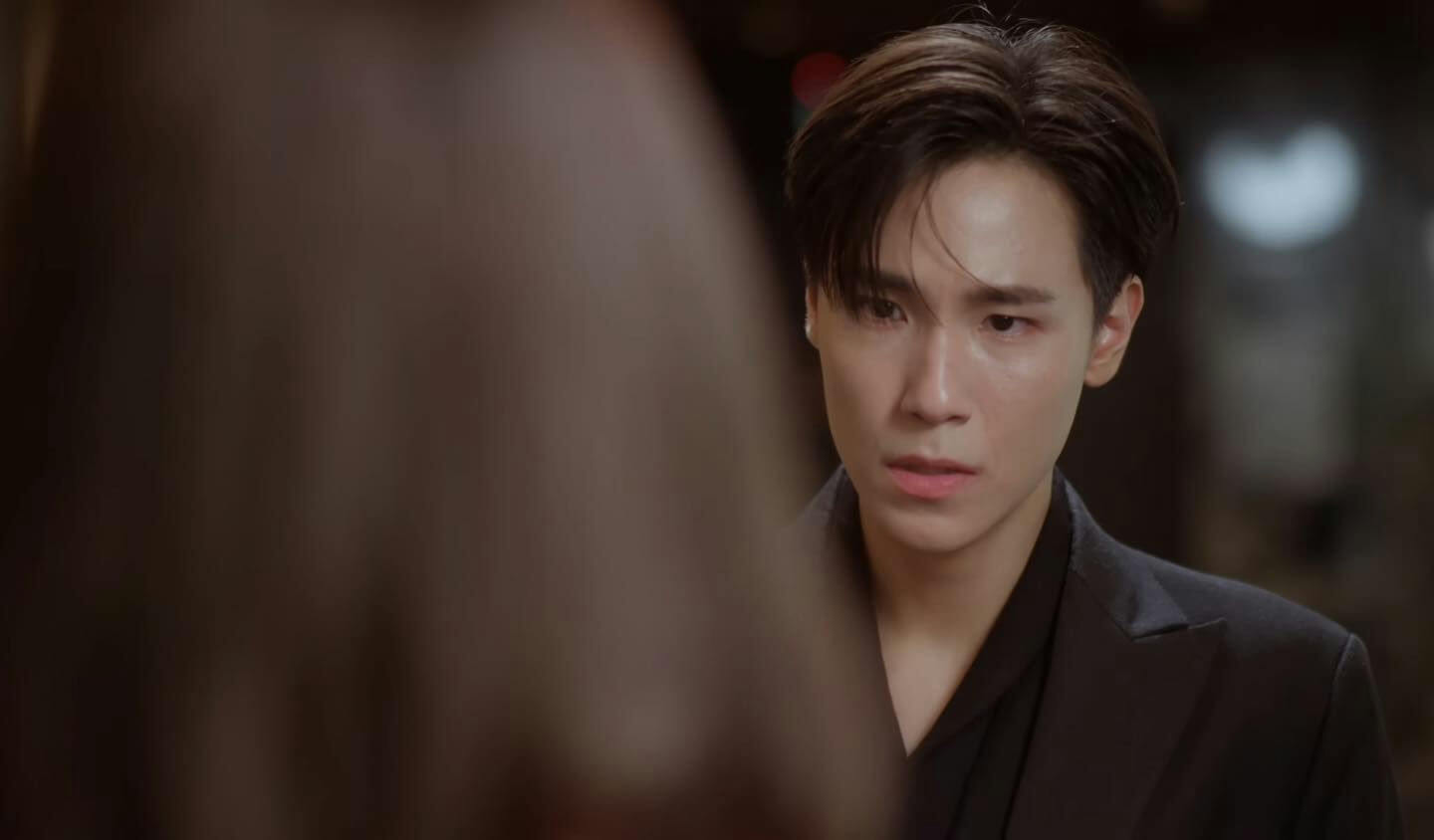 people-man-intense gaze-black suit-dramatic lighting