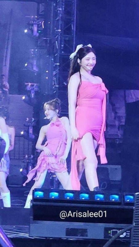 people-Two K-Pop idols-A-pink dresses-A-on stage-B-smiling-B-performance-C