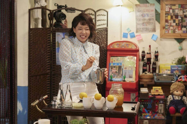 people-woman-A-smiling-A-mixing_drink-A-indoor-A-retro_setting